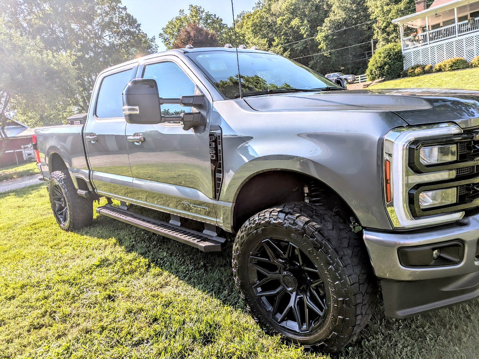 Silver lifted Ford Super Duty truck hand washed and waxed on a Licking County, Ohio property