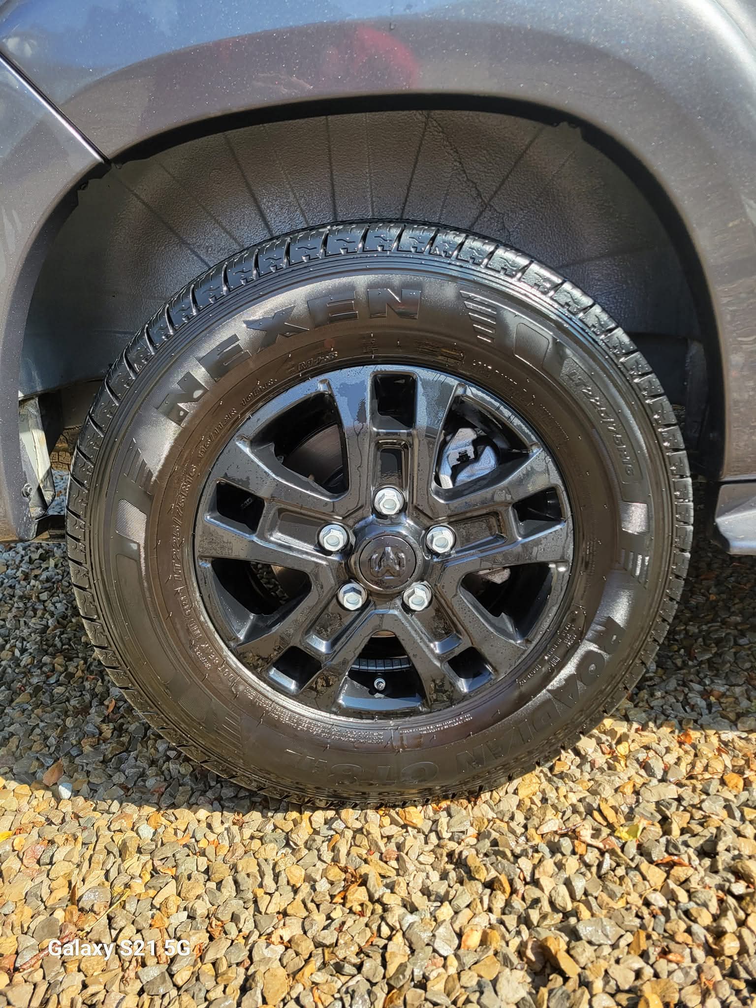 Freshly washed truck wheel and dressed tire after an exterior wash, wax, and wheel detail in Newark, Ohio