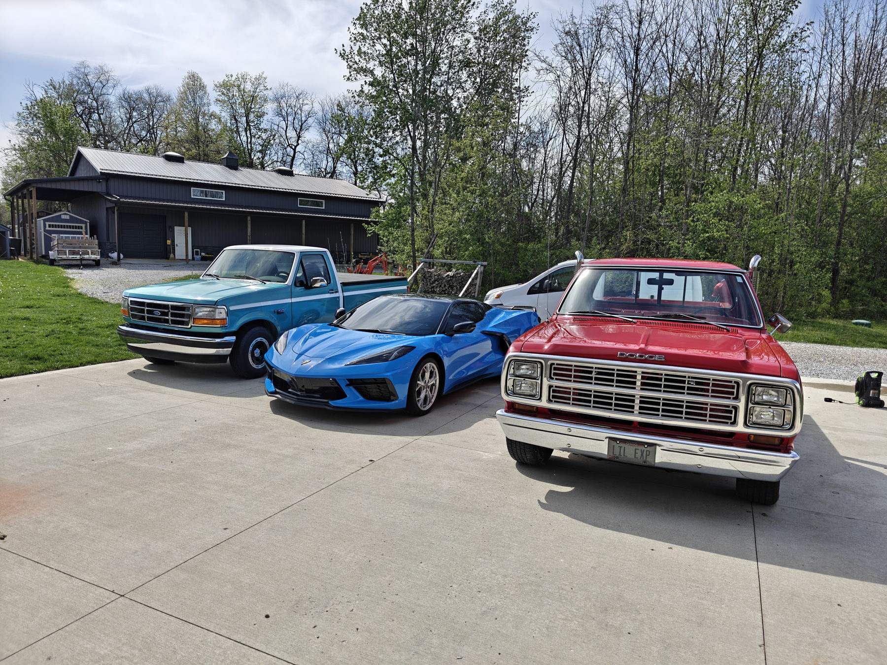 Customer vehicles detailed by JMIDS parked outside the Newark, Ohio shop building