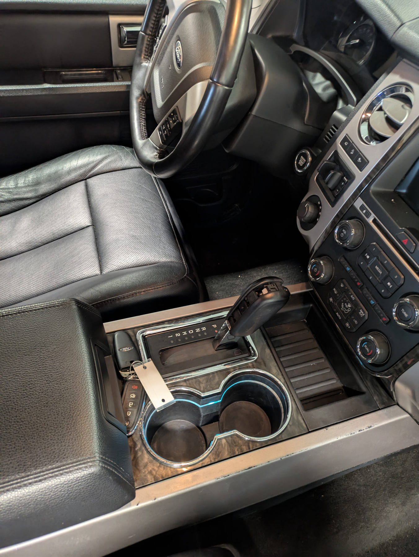 Interior detailing in Newark, Ohio: cleaned leather seats, console, and dash of a Ford truck cab