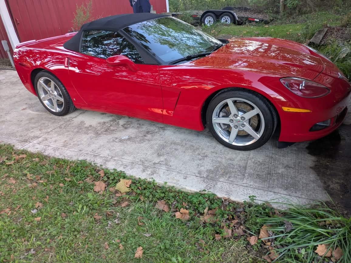 Red Chevrolet Corvette convertible with a glossy hydrophobic finish after ceramic coating and sealant application in Newark, Ohio
