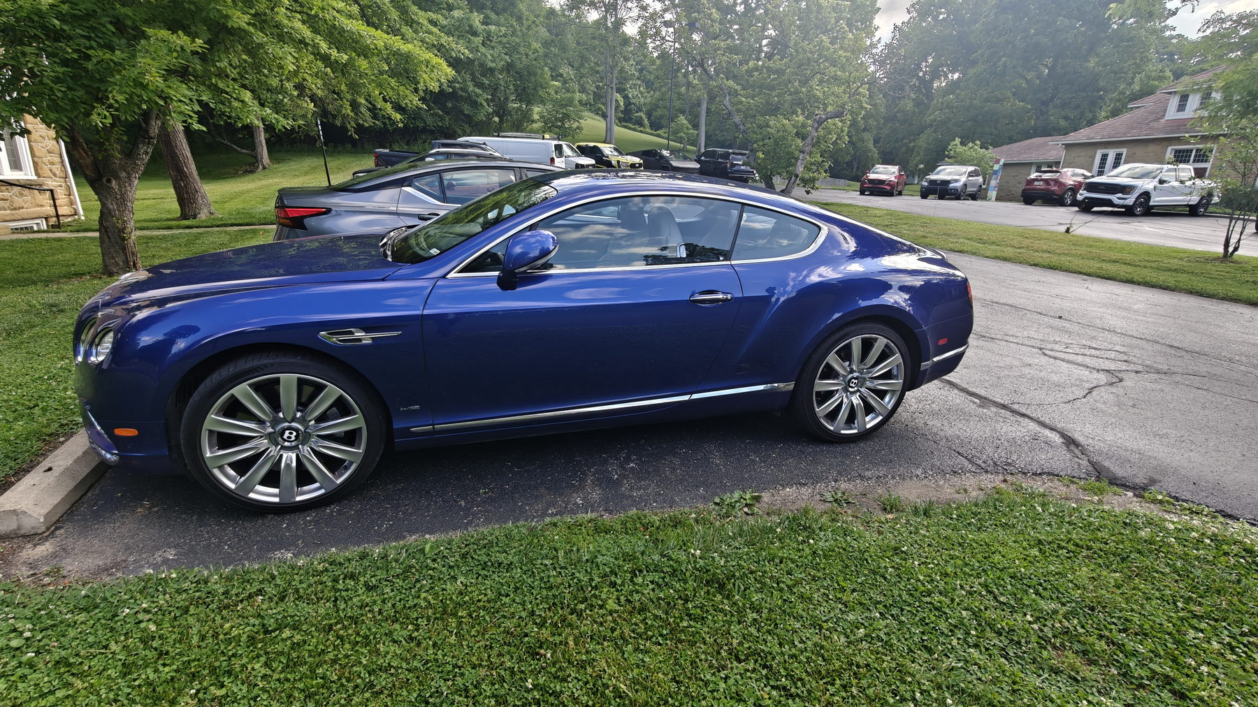 Blue Bentley coupe with swirl-free mirror gloss after paint correction and polishing in Newark, Ohio